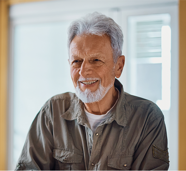 Older male patient smiling — candidate for balloon sinuplasty
